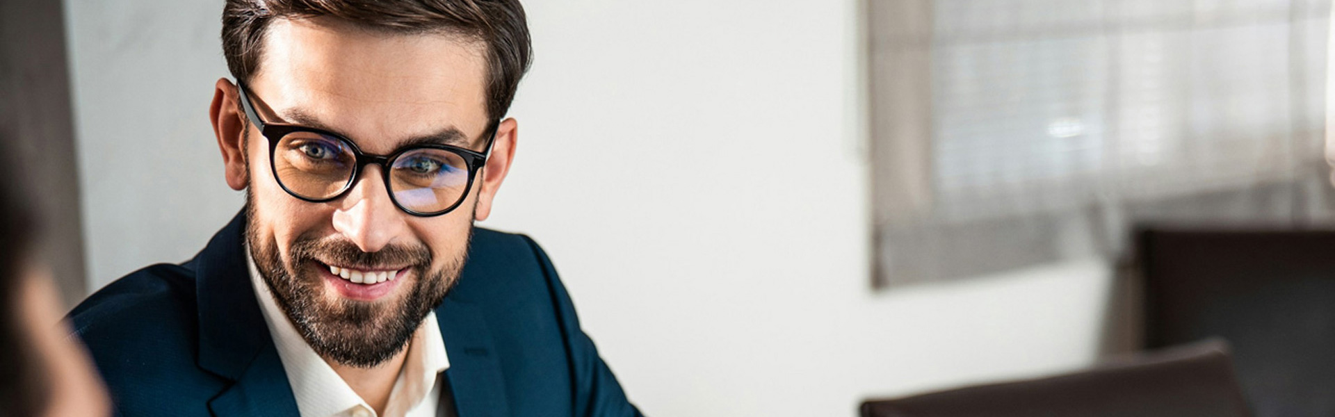 White male in glasses reviews HIPAA compliance with a male healthcare practice