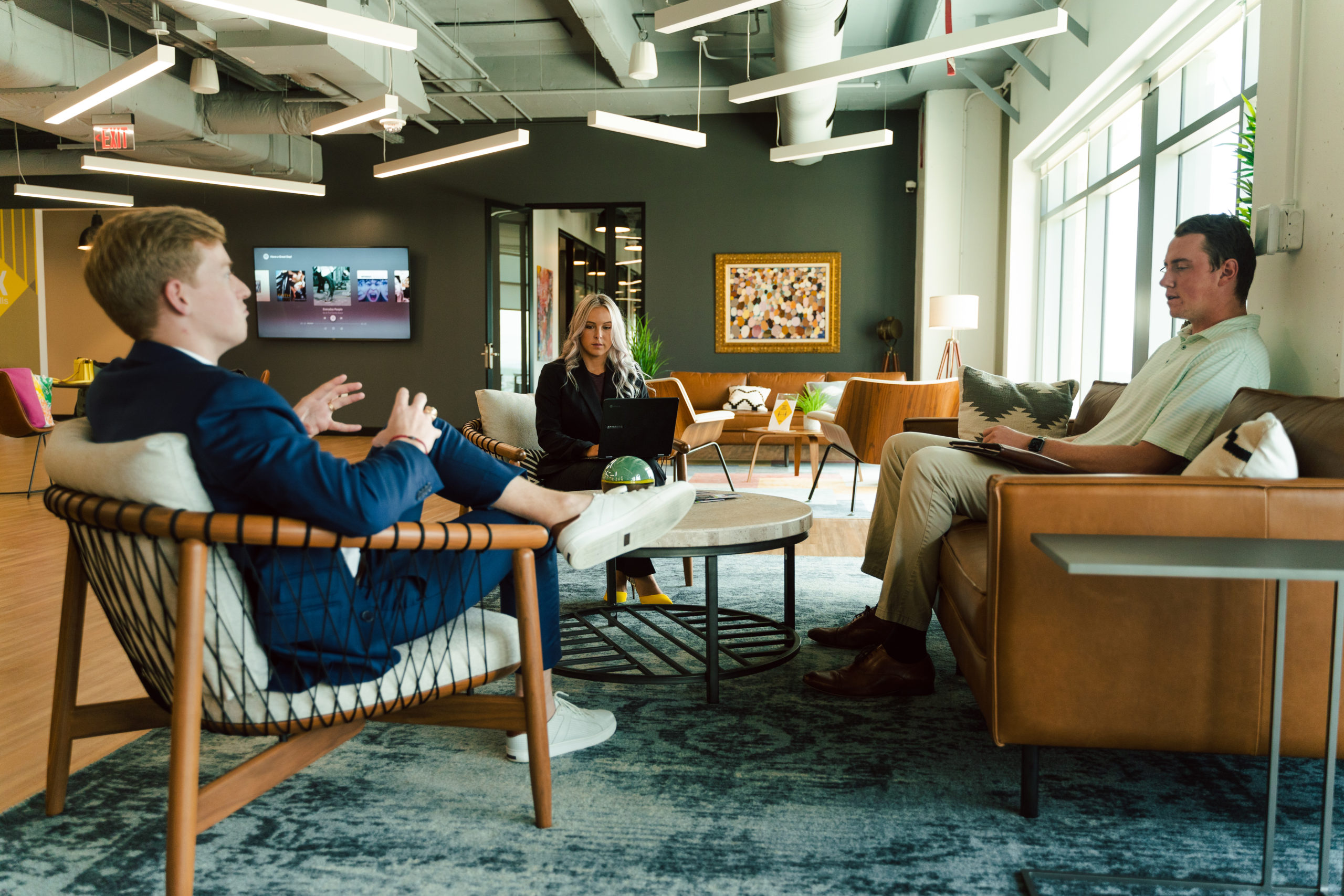 Healthcare Consulting Contact Venture X Office with three people sitting in the lobby working